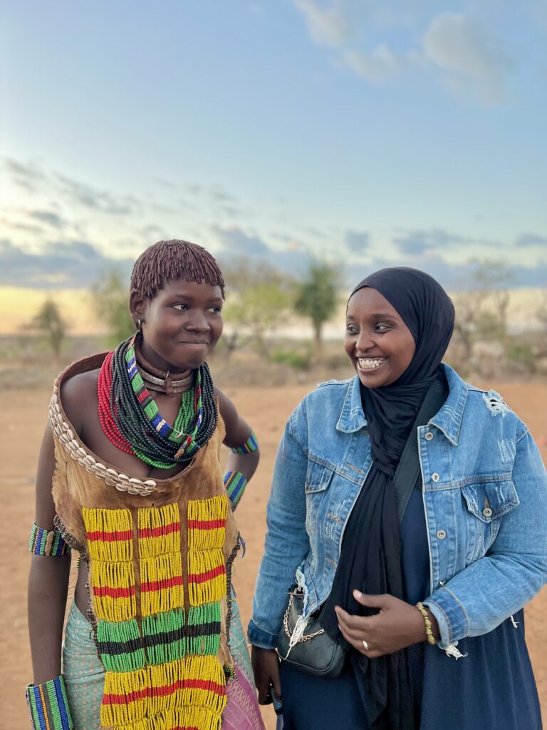 Marian Abdi visiting the Hamar tribe in Ethiopia’s Omo Valley, sharing a moment of cultural connection beyond headlines.